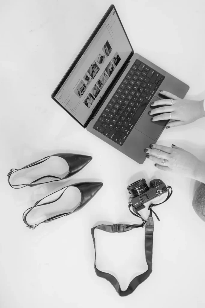 Custom web design agency workspace — laptop, camera, and creative tools from Hi Lo Design Co
